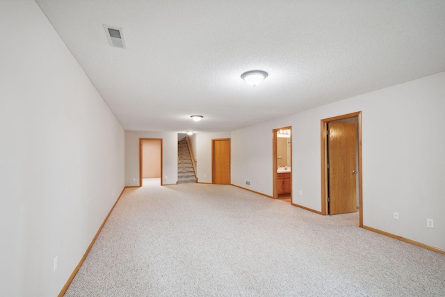 14208 Heritage Ln, Apple Valley, MN 55124 - unfurnished room featuring light carpet and stairs