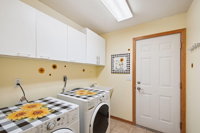 14208 Heritage Ln, Apple Valley, MN 55124 - washroom with cabinet space, separate washer and dryer, and light tile patterned floors
