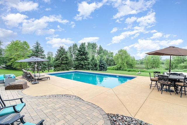 19270 Foxfield Dr, Credit River Twp, MN 55372 - outdoor pool with a patio area, outdoor dining space, view of scattered trees, and outdoor lounge area