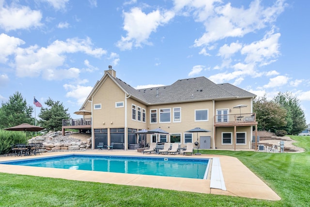 19270 Foxfield Dr, Credit River Twp, MN 55372 - swimming pool with a patio area, a sunroom, a lawn, and outdoor dining area