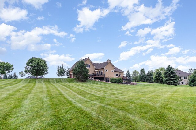 19270 Foxfield Dr, Credit River Twp, MN 55372 - view of green lawn featuring a wooden deck