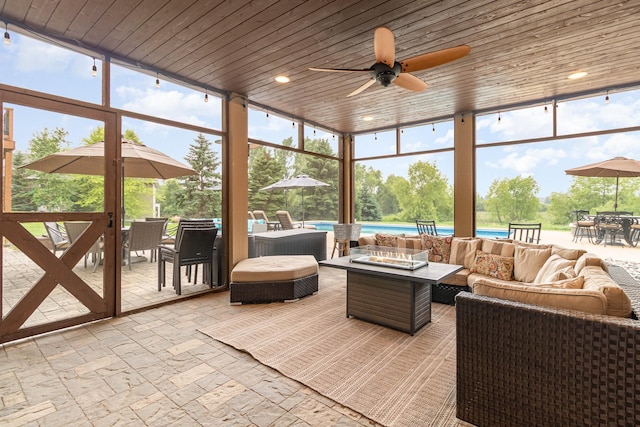 19270 Foxfield Dr, Credit River Twp, MN 55372 - sunroom featuring outdoor dining area, an outdoor living space with a fire pit, and a ceiling fan