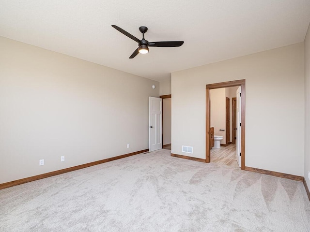 1136 168th Ln NW, Andover, MN 55304 - unfurnished bedroom with light carpet, connected bathroom, and ceiling fan
