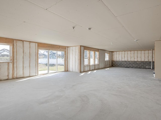 1136 168th Ln NW, Andover, MN 55304 - spare room featuring plenty of natural light and concrete floors