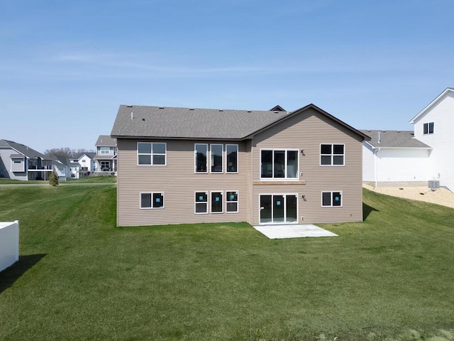1136 168th Ln NW, Andover, MN 55304 - back of house featuring a lawn and a patio