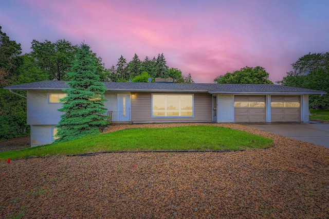 12258 Crooked Lake Blvd NW, Coon Rapids, MN 55433 - ranch-style house featuring concrete driveway, a lawn, an attached garage, and brick siding
