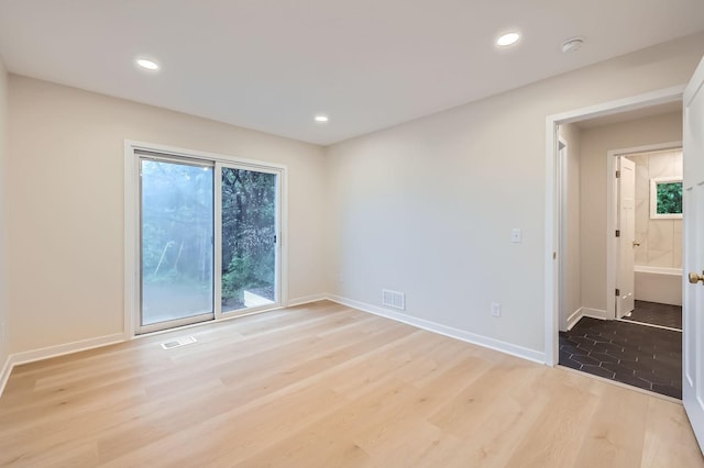 12258 Crooked Lake Blvd NW, Coon Rapids, MN 55433 - empty room with light wood-type flooring, a smoke detector, and recessed lighting