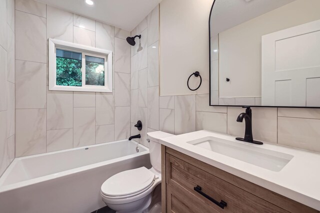 12258 Crooked Lake Blvd NW, Coon Rapids, MN 55433 - full bath with tile walls, vanity, and bathing tub / shower combination