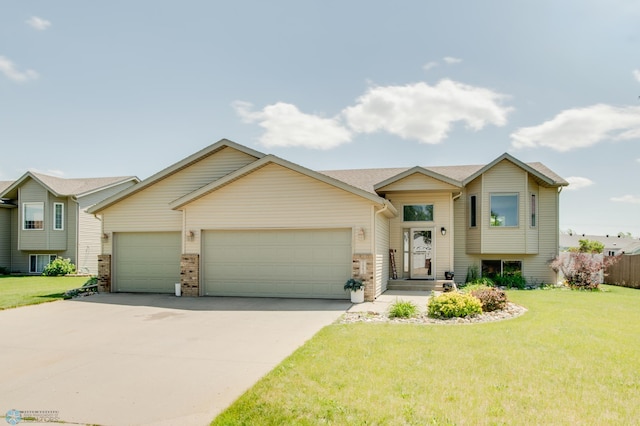 1083 Parkway Ln, West Fargo, ND 58078 - split level home featuring an attached garage, driveway, and a front lawn