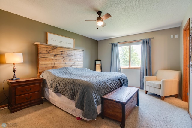 1083 Parkway Ln, West Fargo, ND 58078 - bedroom with light colored carpet, a textured ceiling, and ceiling fan