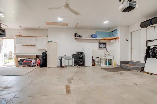 1083 Parkway Ln, West Fargo, ND 58078 - garage with a garage door opener, ceiling fan, and recessed lighting