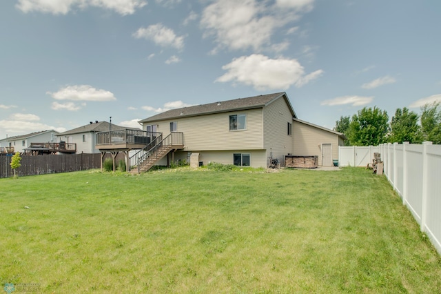 1083 Parkway Ln, West Fargo, ND 58078 - back of property with a wooden deck, stairway, and a fenced backyard