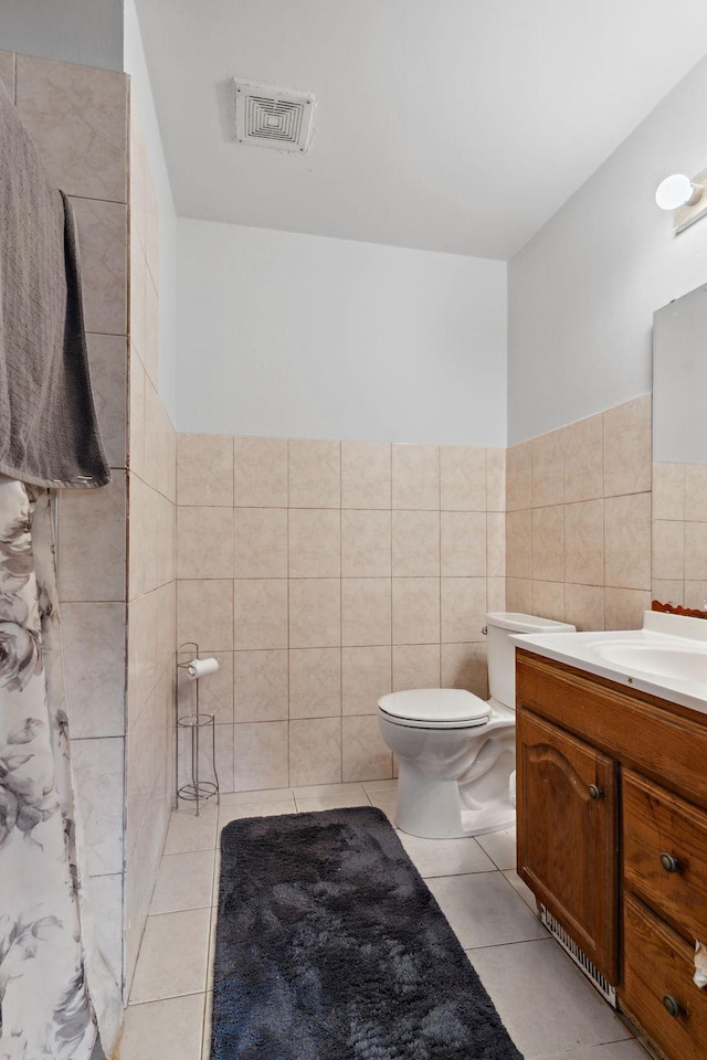 4421 Cinnamon Ridge Cir, Eagan, MN 55122 - full bathroom with tile walls, vanity, tile patterned floors, and a wainscoted wall