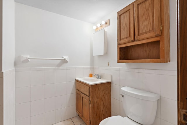 4421 Cinnamon Ridge Cir, Eagan, MN 55122 - bathroom with vanity, tile walls, a wainscoted wall, and tile patterned floors