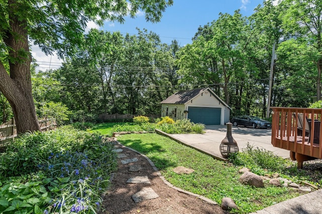 123 Franklin Ave, Owatonna, MN 55060 - view of yard with an outdoor structure, a garage, and a deck