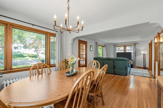 123 Franklin Ave, Owatonna, MN 55060 - dining space featuring a chandelier and light wood-style floors