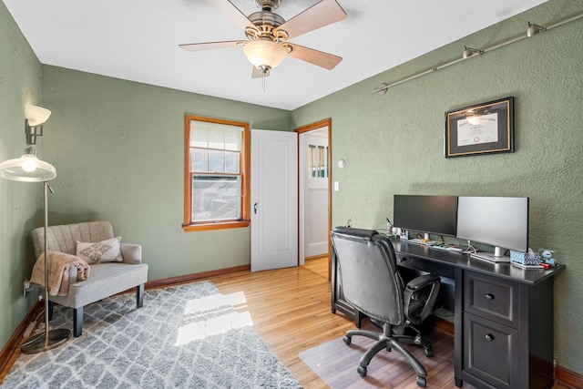 123 Franklin Ave, Owatonna, MN 55060 - home office featuring light wood finished floors, ceiling fan, and a textured wall