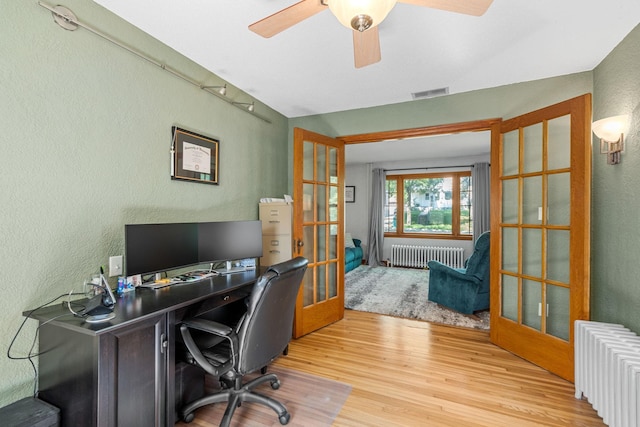 123 Franklin Ave, Owatonna, MN 55060 - office area with radiator, french doors, a textured wall, wood finished floors, and ceiling fan