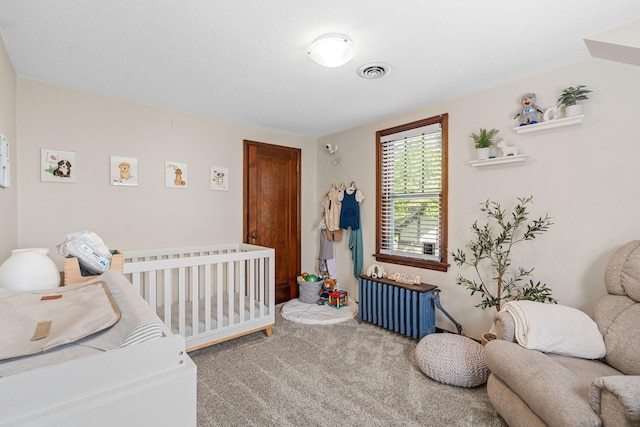 123 Franklin Ave, Owatonna, MN 55060 - carpeted bedroom with radiator and a nursery area