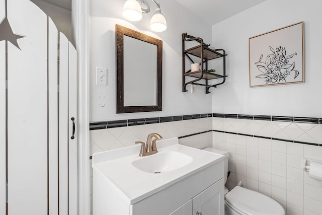 123 Franklin Ave, Owatonna, MN 55060 - half bath with vanity, wainscoting, and tile walls
