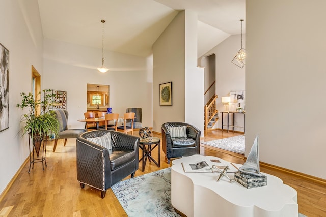 201 75th Ave N, Brooklyn Park, MN 55444 - living room with stairs, wood finished floors, and high vaulted ceiling