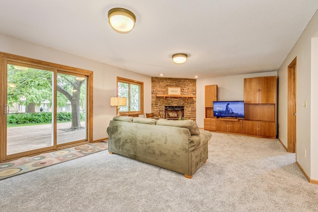 201 75th Ave N, Brooklyn Park, MN 55444 - living room featuring light carpet and a fireplace