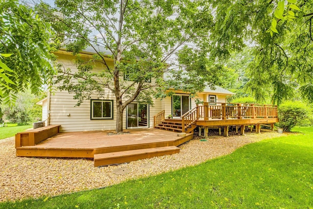 201 75th Ave N, Brooklyn Park, MN 55444 - back of property with a yard and a wooden deck