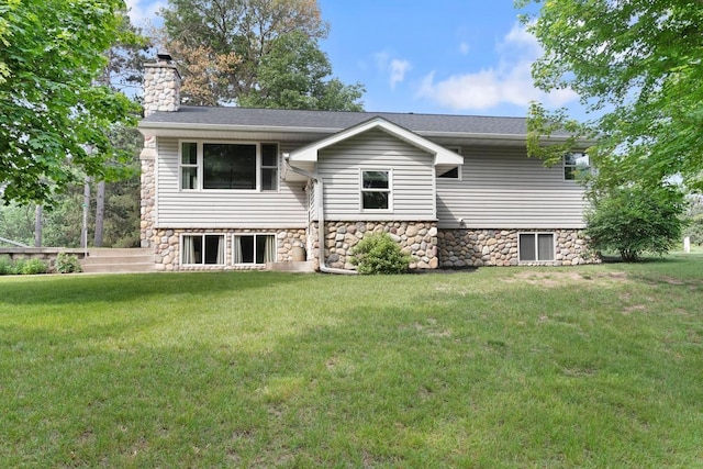23481 Fontana St NE, Linwood Twp, MN 55079 - back of house featuring a chimney, a yard, and stone siding