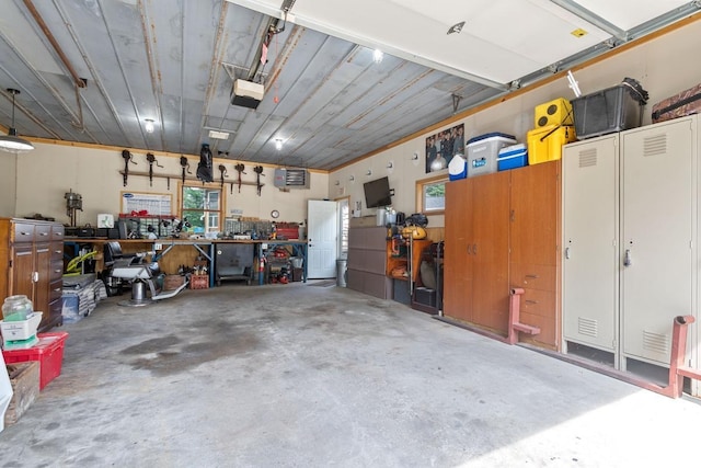 23481 Fontana St NE, Linwood Twp, MN 55079 - garage featuring a garage door opener and a workshop area