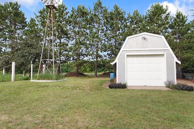 23481 Fontana St NE, Linwood Twp, MN 55079 - view of grassy yard featuring an outdoor structure and a detached garage