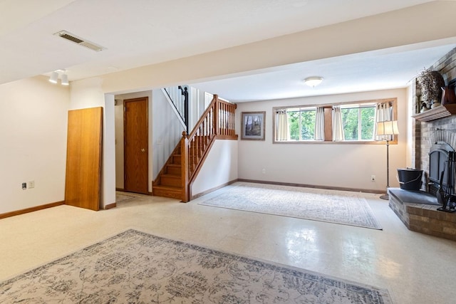 23481 Fontana St NE, Linwood Twp, MN 55079 - unfurnished living room with stairway and a fireplace