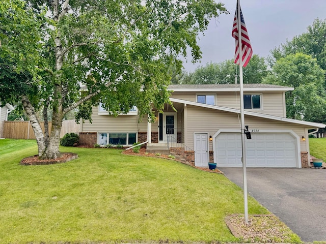 4982 148th Path W, Apple Valley, MN 55124 - view of front facade with an attached garage, driveway, and brick siding