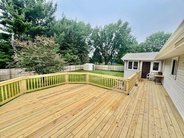 4982 148th Path W, Apple Valley, MN 55124 - wooden deck featuring a shed, a fenced backyard, and view of wooded area