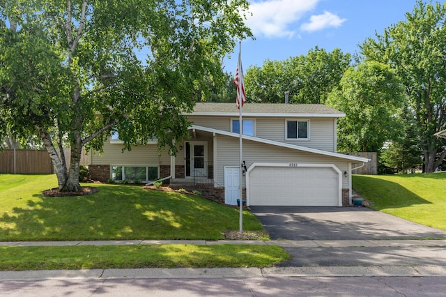 4982 148th Path W, Apple Valley, MN 55124 - view of front of house with a garage, asphalt driveway, and brick siding