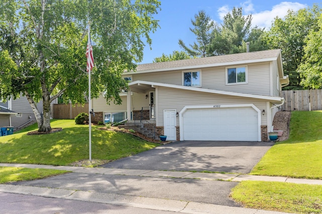 4982 148th Path W, Apple Valley, MN 55124 - bi-level home featuring a garage and asphalt driveway