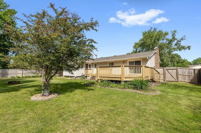 4982 148th Path W, Apple Valley, MN 55124 - rear view of house featuring a fenced backyard, a deck, a chimney, and a gate