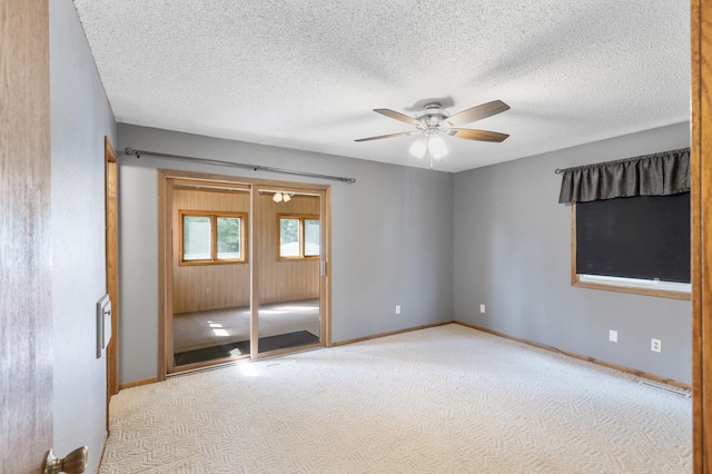 4982 148th Path W, Apple Valley, MN 55124 - carpeted spare room with a ceiling fan and a textured ceiling