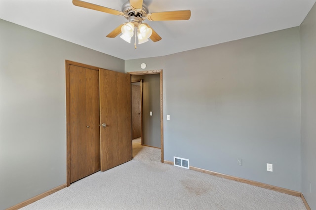 4982 148th Path W, Apple Valley, MN 55124 - unfurnished bedroom featuring light carpet, a closet, and a ceiling fan