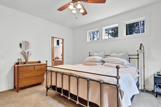 35853 Whispering Pine Way, Florence Twp, MN 55041 - bedroom with light carpet, ceiling fan, and ensuite bathroom