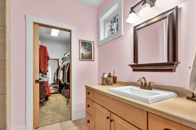 35853 Whispering Pine Way, Florence Twp, MN 55041 - bathroom with vanity, tile patterned flooring, and a walk in closet