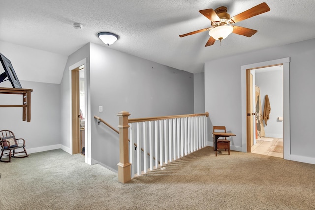 35853 Whispering Pine Way, Florence Twp, MN 55041 - corridor featuring carpet flooring, an upstairs landing, lofted ceiling, and a textured ceiling