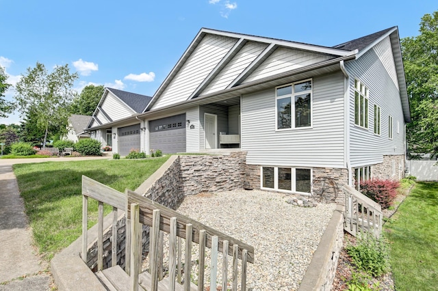 308 Iowa St, Lake City, MN 55041 - view of front of home featuring an attached garage, a front lawn, and driveway