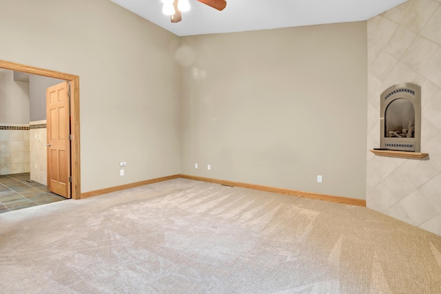 308 Iowa St, Lake City, MN 55041 - unfurnished bedroom featuring carpet floors, tile walls, and ceiling fan