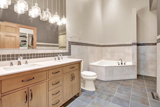 308 Iowa St, Lake City, MN 55041 - full bathroom with double vanity, a bath, and tile patterned flooring