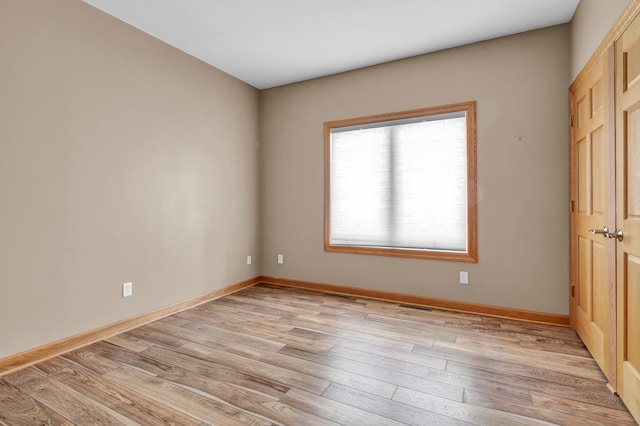 308 Iowa St, Lake City, MN 55041 - unfurnished bedroom featuring light wood finished floors and baseboards