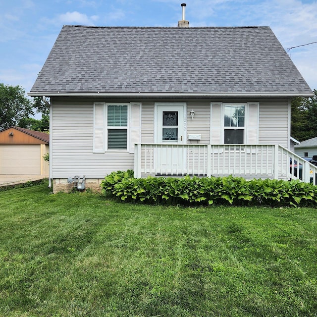 1222 8th Ave SE, Rochester, MN 55904 - rear view of house featuring a shingled roof, an outdoor structure, a lawn, a chimney, and a detached garage