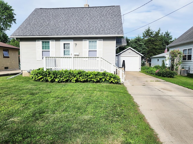 1222 8th Ave SE, Rochester, MN 55904 - view of front of house featuring concrete driveway, an outbuilding, a shingled roof, a detached garage, and a front lawn