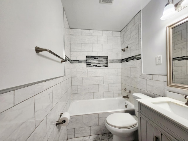 1222 8th Ave SE, Rochester, MN 55904 - bathroom featuring tile walls, vanity, tiled shower / bath, and marble finish floors