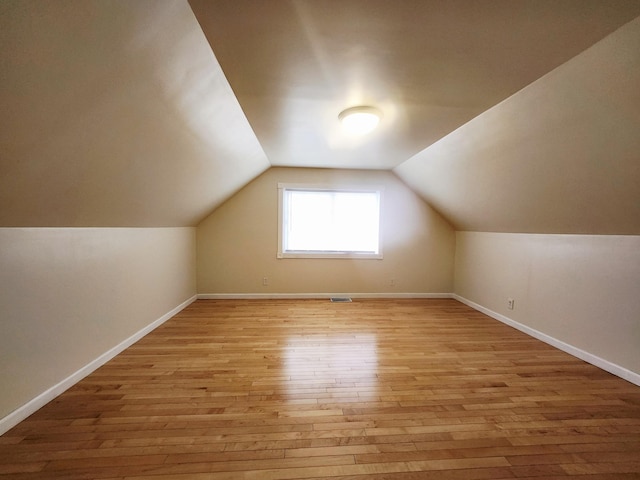 1222 8th Ave SE, Rochester, MN 55904 - bonus room with light wood-style floors and vaulted ceiling