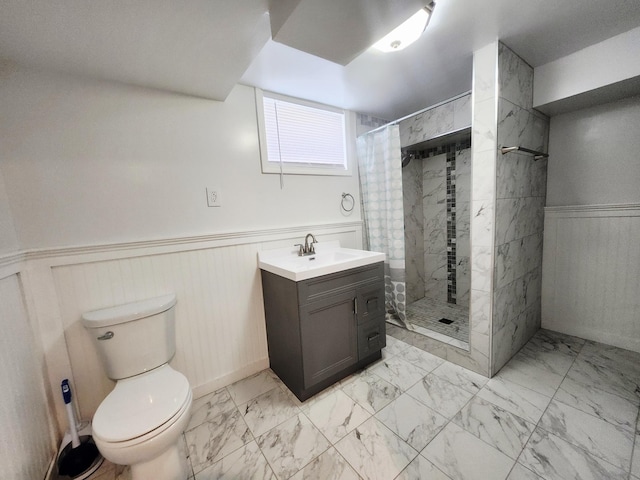 1222 8th Ave SE, Rochester, MN 55904 - full bathroom with marble look tiles, wainscoting, a stall shower, and vanity